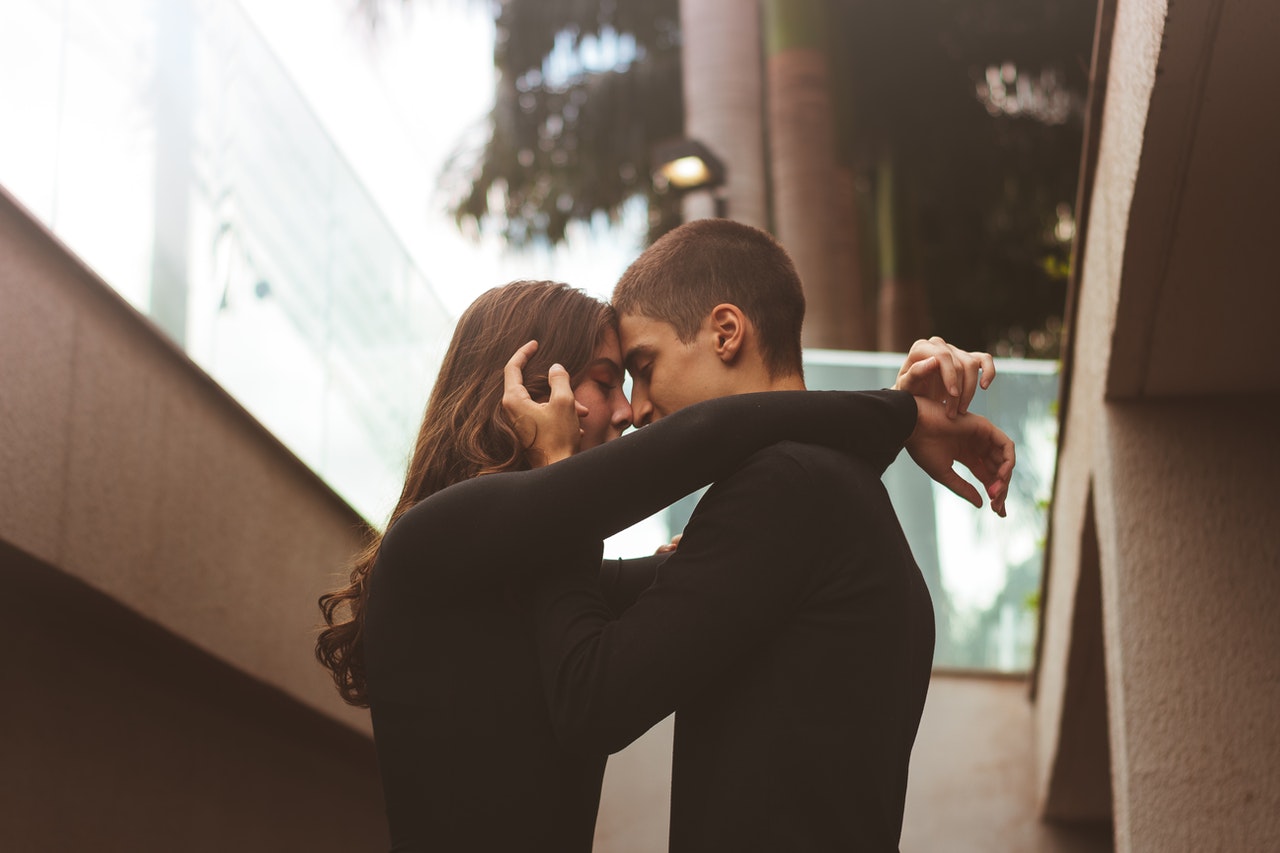 couple kissing on the staircase