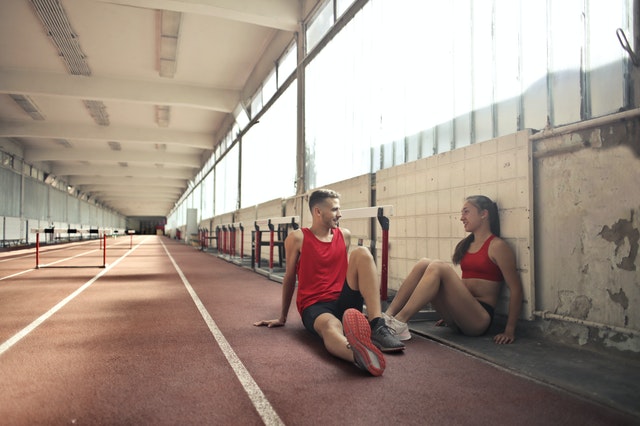 couple talking at the gym