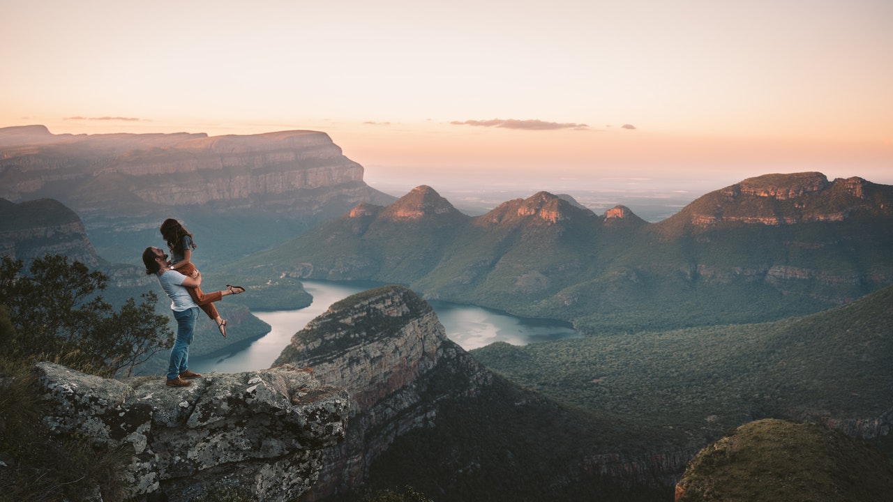 couple sitting on a mountain