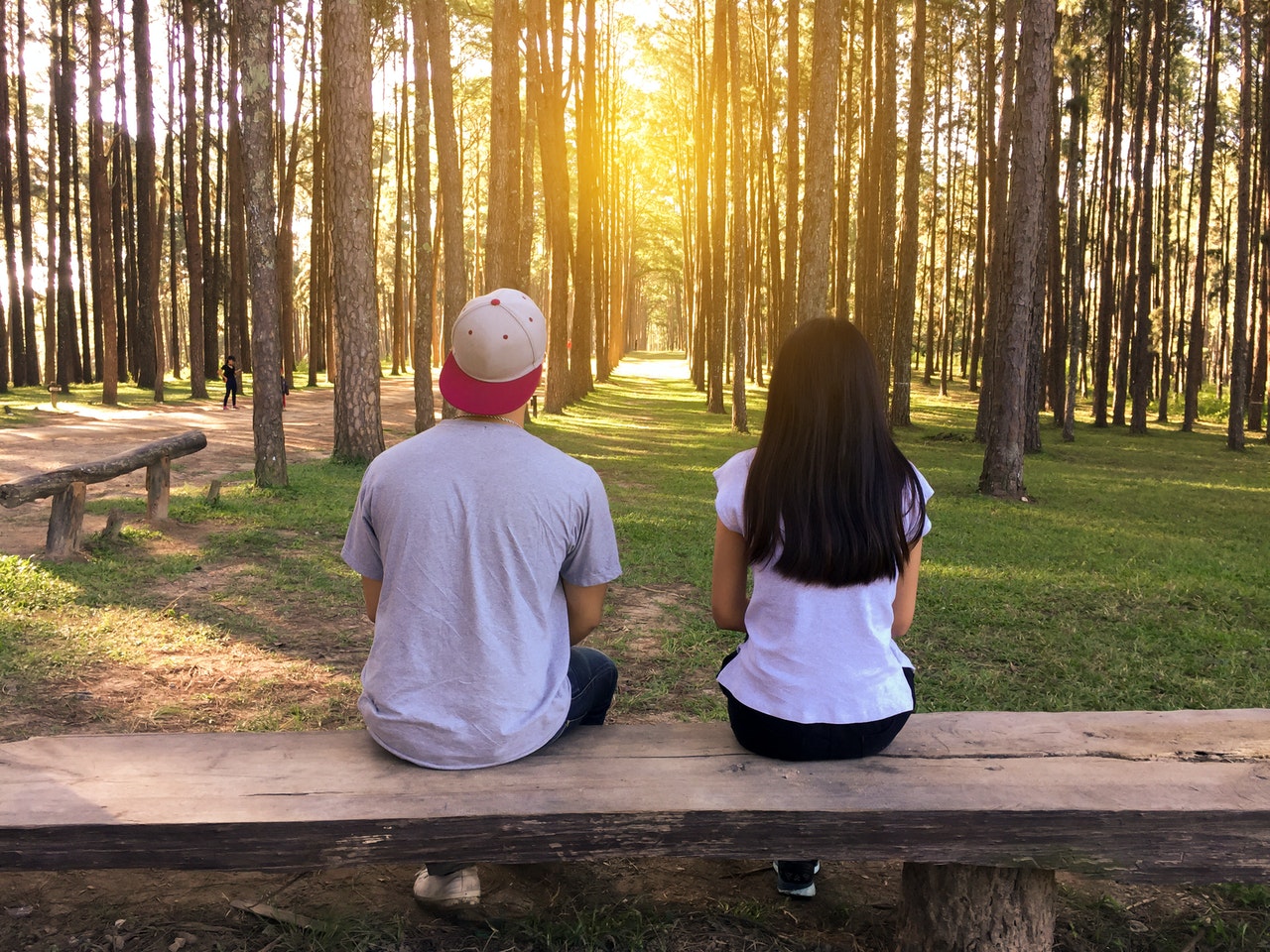 man and woman on bench