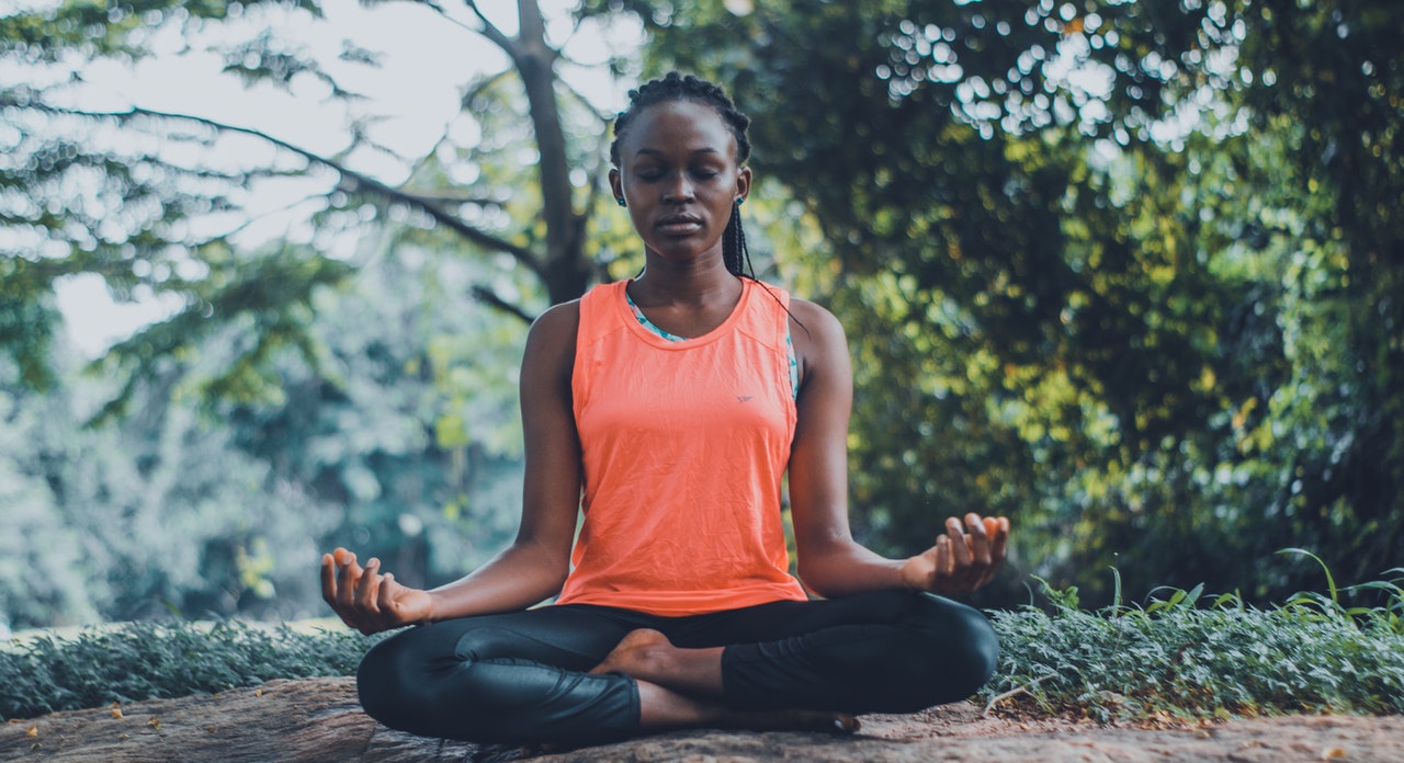 woman meditating outdoors woman meditating outdoors
