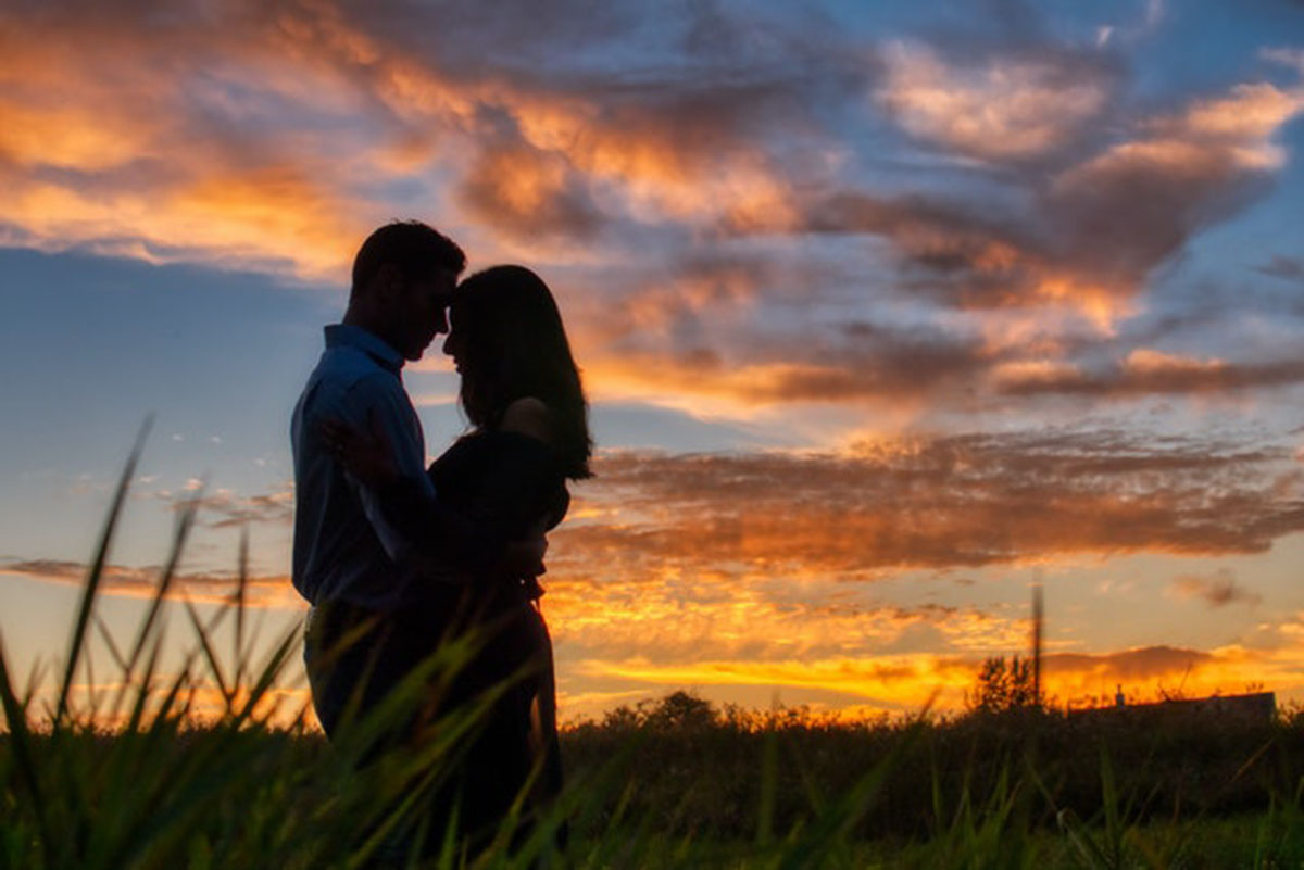 couple hugging at sunset